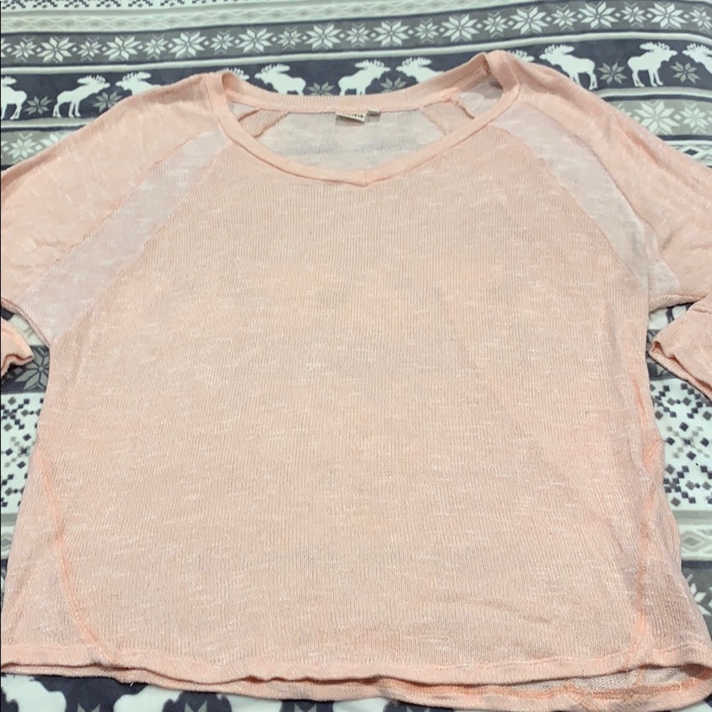 Loose fitting light pink sweater